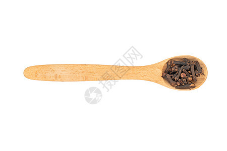 勺子中的干丁种子木头香味香气美食香料粮食植物味道芳香图片