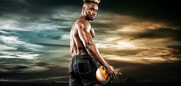 美国黑人运动员的肖像 排球运动员在天空日落时带球 适合穿着运动服拿着球的年轻人肌肉玩家相机力量动机身体健康团队行动黑色图片