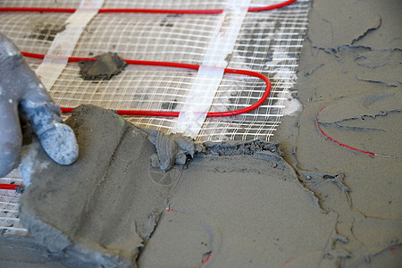 在水泥坑下面铺设电动地板下加热线圈管子砂浆建造技术管道金属平板气候散热器图片