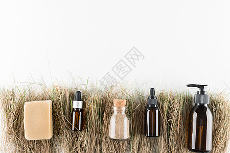 生态化妆品概念 在玻璃瓶中不塑料玻璃温泉海绵木头奶油洗发水酒吧肥皂瓶子液体图片