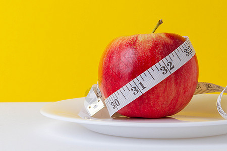 以苹果作为减肥的手段 肥胖问题 水果饮食红色食物磁带测量绿色活力营养维生素损失健身房图片