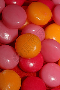 色彩多彩的圆形香味泡泡口香糖特写背景蓝色紫色薄荷食物橙子甜点赞成生日喜悦童年图片