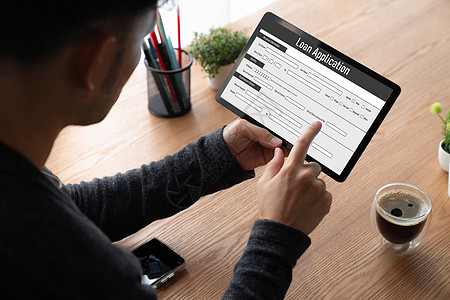 现代数字信息收集在线贷款申请表网上贷款申请表展示银行桌子技术服务商业商务现金男人笔记本图片