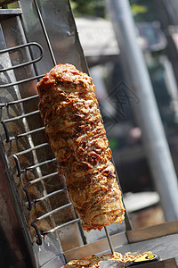 土耳其烤肉饭沙瓦玛肉被切开小吃街道烤肉炙烤食物牛肉旋转捐赠者烤箱羊肉背景