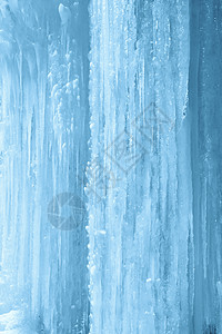 冷冻瀑布墙上的冰柱垂直背景图片