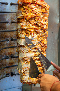 厨师切刀切面包刀土耳其传统多纳克巴肉旋转食物文化街道午餐羊肉陀螺仪烹饪美食捐赠者图片