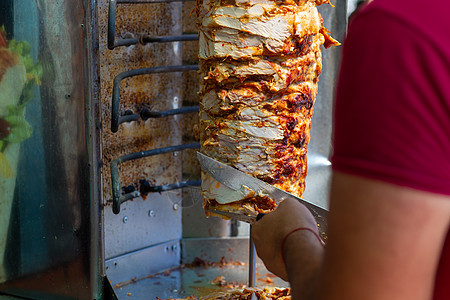厨师切刀切面包刀土耳其传统多纳克巴肉小吃火鸡烹饪美食午餐文化猪肉街道餐厅炙烤图片