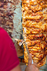 厨师切刀切面包刀土耳其传统多纳克巴肉美食食物捐赠者火鸡街道烧烤陀螺仪小吃猪肉羊肉图片