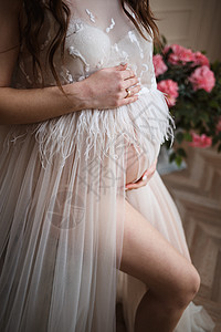 相片怀孕女孩 怀孕 闭合 粉红色裙子图片