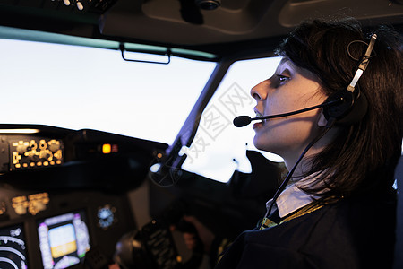 女副联合驾驶员 驾驶舱飞行飞机和仪表板指挥图片