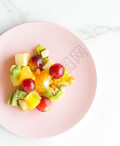 大理石 平板     饮食和健康生活方式概念的早餐用多汁水果沙拉奇异果甜点石头盘子素食食品桌子食谱生活方式橙子图片