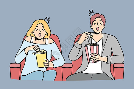 夫妻在电影院里吃爆米花观众男人休息剧院小吃运动闲暇插图电影房间图片