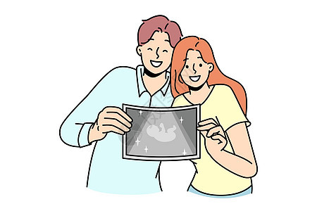 快乐的一对夫妇展示了婴儿超声波照片诊断扫描咨询病人技术女士分娩妇科超声治疗图片