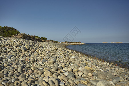 海滩石头景观晴天热带海浪卵石太阳蓝色异国情调海岸季节图片