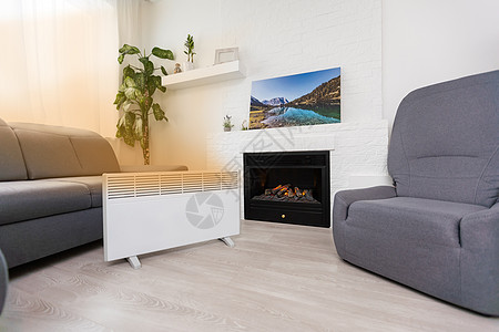 现代电热器在室内时尚房间散热器经济技术马桶加热气候温度公寓空气温暖图片