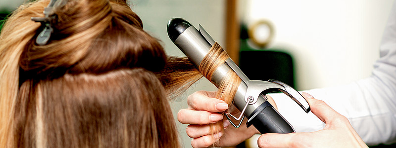 吹风员用卷发铁扭头发发型师发型女性成人爆头顾客造型工作室卷发器理发图片