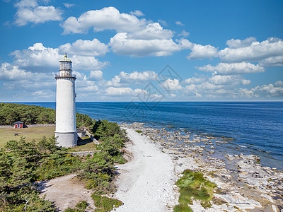 海滩上有海云的白色灯塔空中观光景象支撑海岸线海岸天空蓝色戏剧性沙丘岩石太阳日落图片