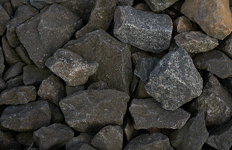 巨型花岗岩可塑石的质地卵石地质学灰色石墙建筑公园崎岖风化岩石石头图片