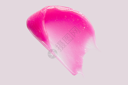 粉红脸润肤膏牙刷湿润剂纹理 (注 白斑点的粉色面部润滑剂)图片