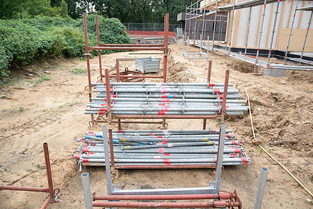 新建房屋建筑工地的坚固金属脚架 开始于2002年7月1日脚手架安全绳索力量龙门架工具桁架建造构造大厅图片