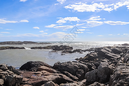 冰岛一片岩石沙滩上的黑沙冲浪风暴天气地质学天空海浪风景石头旅游海景旅行图片