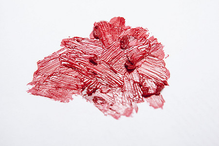 白色背景上涂满红口红唇膏产品化妆品嘴唇奶油艺术家图片