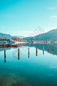 德国巴伐利亚阿尔卑斯山码头Tegernsee湖沿岸的Picturesque渔村房屋码头日落海岸森林太阳旅行村庄反射地平线图片