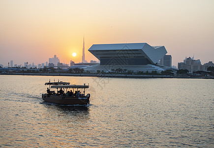 迪拜节市日落图书馆在现场的新建筑以及世界上最高的背景建筑旅游天气城市记录天空建造日落假期访问海湾背景图片