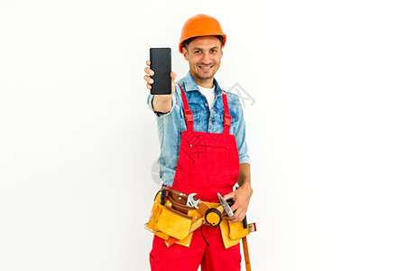 穿着制服短黑色头发的男性建筑工人后视线 单人独居电话商业维修安全帽建筑承包商工人男人工作腰带图片