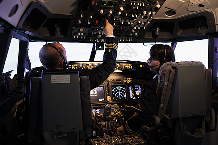航空班机小组飞行飞机和仪表板指挥飞机图片