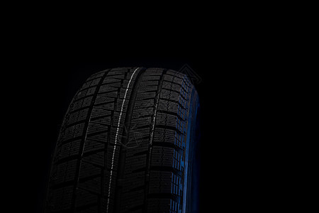 新橡胶轮胎 黑色背景的黑底缝合背景图片