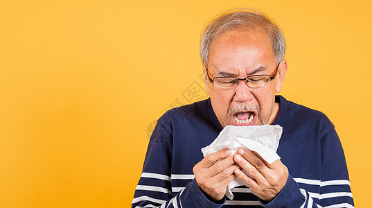 亚洲老人感冒 感冒和打喷嚏 因疾病病毒问题使用组织鼻子花粉流感疼痛老年长老成人发烧哮喘过敏图片