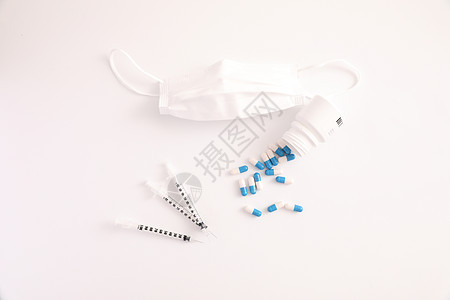 白背景中与药片和面罩隔离的症状科学流感疫苗药品治疗治愈注射免疫注射器塑料图片