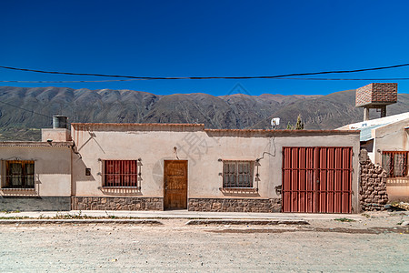 安第斯山脉阿根廷La Poma村的Argentinian村街道黏土建筑石头历史性建筑学地球窗户房子遗产农村图片