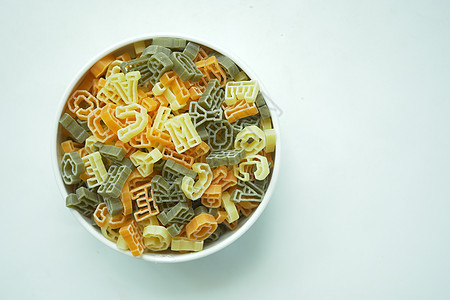 干字母形状意面小麦食物卷曲美食文化黄色主食三色厨房螺旋图片
