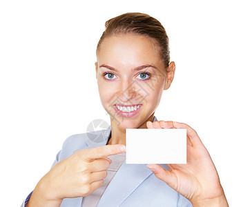拿着一张空白的招贴的愉快的女商务人士 微笑的女商务人士指着一张空白的招贴 被白色隔离图片