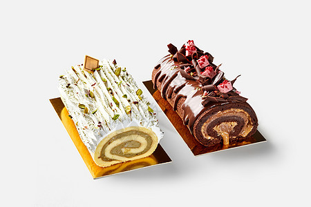 两份瑞士蛋糕卷香草和巧克力饼干饼图片