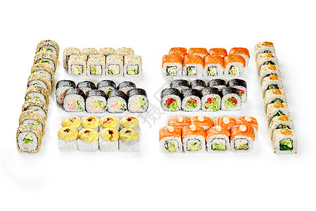 准备与各种日本寿司卷的家庭晚宴图片