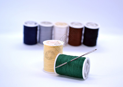 线条和针头衣服裁缝工艺纤维创造力黄色针线活白色织物装饰图片