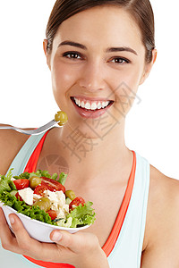 你的健康就是你真正的财富 白种背景的女人准备吃沙拉了!