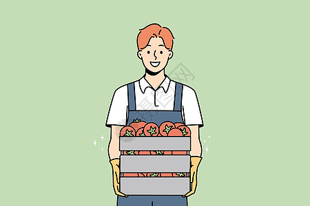 用一盒西红柿给男性农民微笑图片