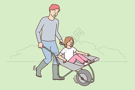 快乐的父亲和女儿一起在田里玩图片