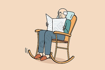 年长男子坐在椅子上阅读报纸图片