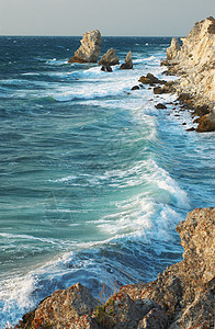 蓝海风暴力量岩石波浪海滩海岸线泡沫地平线运动风景日落图片
