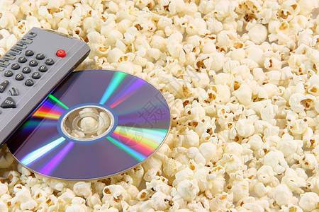 爆米花 dvd 盘和远程电视光盘棕色技术小吃玉米白色盐渍电影塑料图片