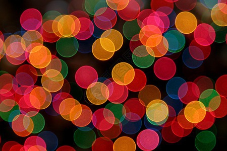 多彩色灯光季节性红色水平细绳假期喜悦庆典黑色绿色背景背景图片