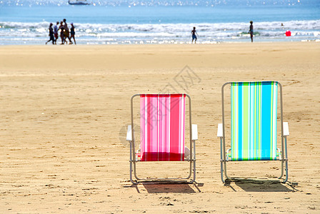 海滩椅海浪晴天假期海岸家庭支撑太阳冲浪剪影波浪图片