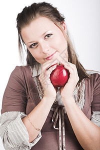 带着红苹果的年轻微笑的女人生活卫生食物青年营养饮食蔬菜女性保健果味图片