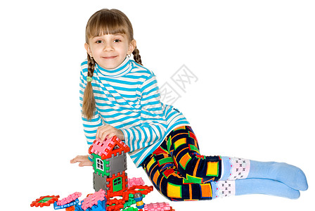 带着麦卡诺的姑娘头发孩子气眼睛喜悦嘴唇幼儿园青年童年玩具快乐图片