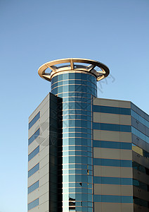 高现代建筑光环线条故事天空圆圈反射玻璃晴天圆形商业背景图片